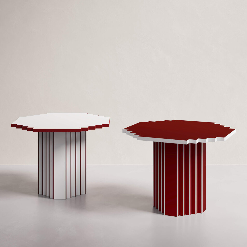 Two Lulu side tables with jagged, serrated edges in red and white, designed by Annette Wernick for Cadenza Visioni.