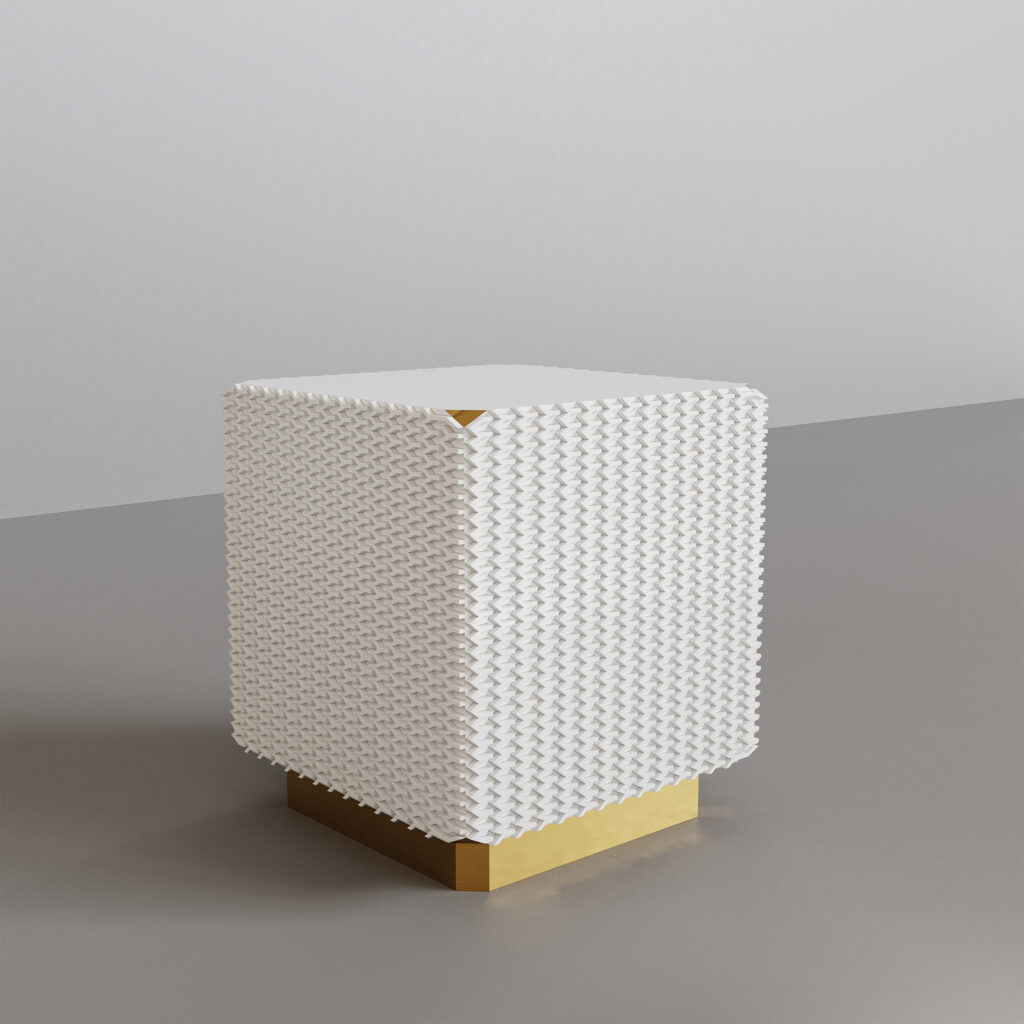 Perspective view of the Azucar side table featuring a white crystalline textured body and a golden base, designed by Annette Wernick.