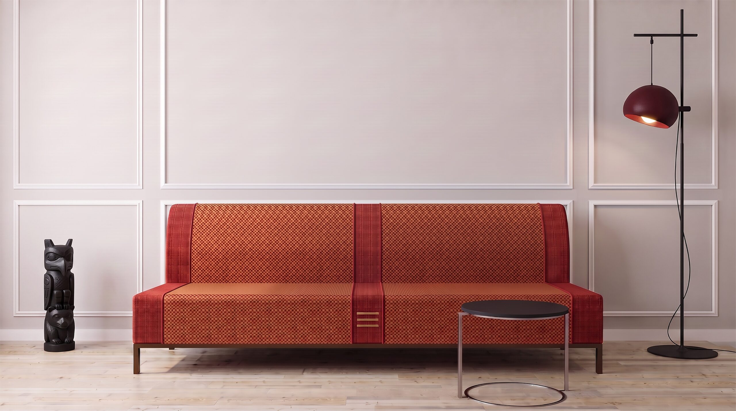 The 'Lignero' sofa designed by Annette Wernick for Cadenza Visioni in a contemporary living room setting. The sleek modern sofa features warm orange and red patterned upholstery and stands against a classic wood-paneled wall, complemented by a minimalist side table, a black totem sculpture, and a red floor lamp.